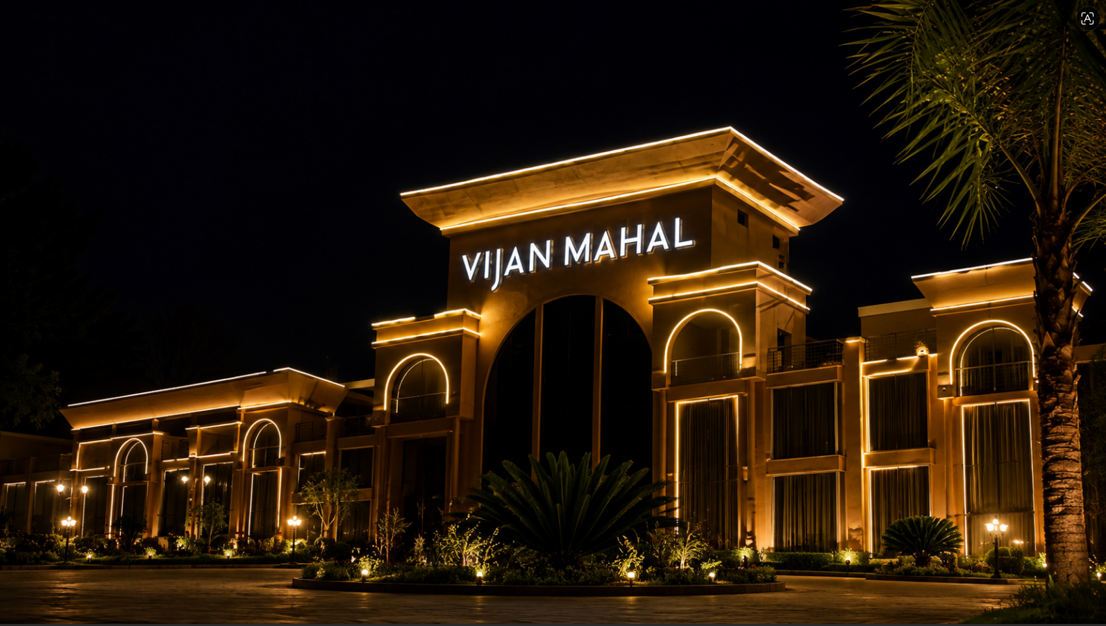 The illuminated entrance arch of Vijan Mahal at night