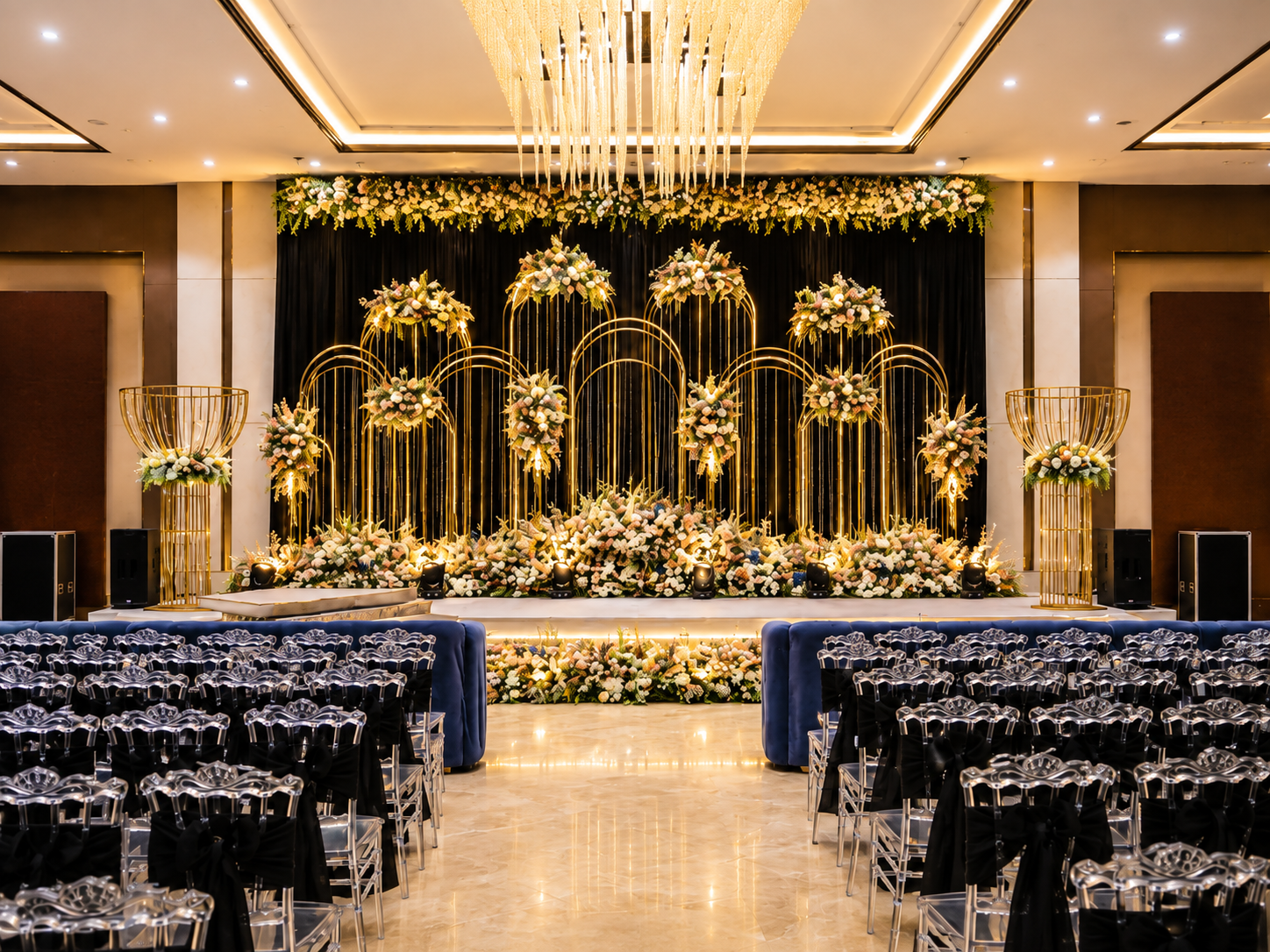 A gold and ivory wedding stage inside Vijan Mahal's banquet